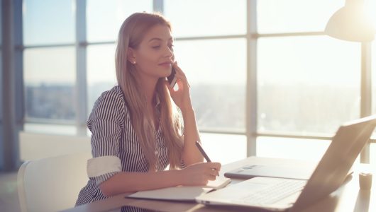 Side,View,Portrait,Of,Young,Businesswoman,Having,Business,Call,In